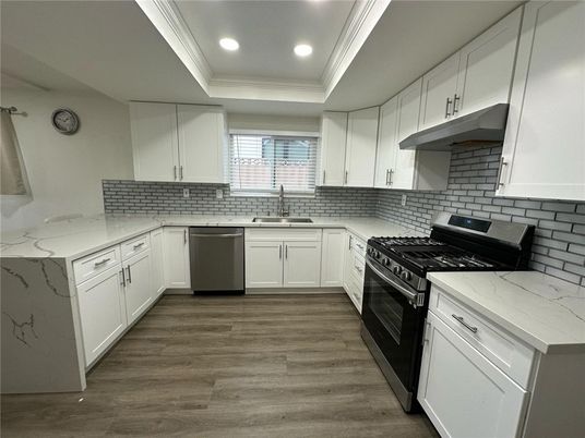 Interior, Kitchen, Recessed Lighting, Stainless Steel Appliances, Wood Texture Flooring