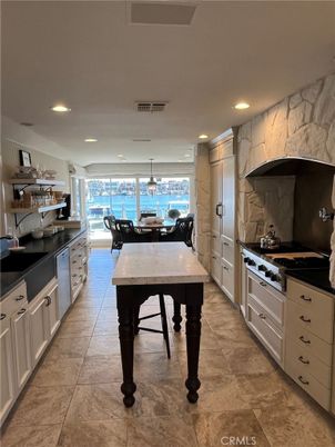 Dining room, Interior, Kitchen, Marble Walls, Pendant Lights, Recessed Lighting, Stainless Steel Appliances, Water