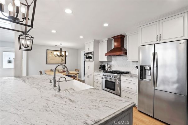 Chandelier, Interior, Kitchen, Pendant Lights, Recessed Lighting, Stainless Steel Appliances, Wood Texture Flooring