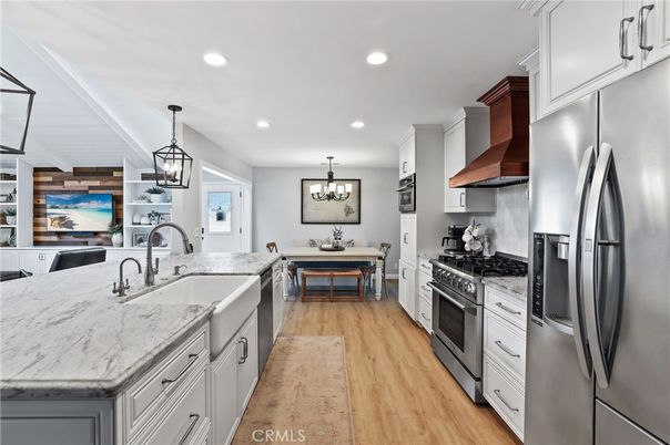 Chandelier, Dining room, Interior, Kitchen, Pendant Lights, Recessed Lighting, Stainless Steel Appliances, Wood Texture Flooring