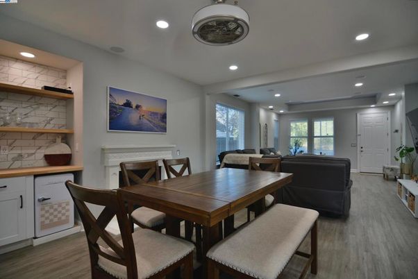 Dining room, Fireplace, Interior, Living room, Recessed Lighting, Wood Texture Flooring