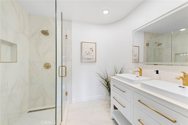 Bathroom, Dual Sink Vanities, Glass Shower, Interior, Marble, Marble Walls, Recessed Lighting