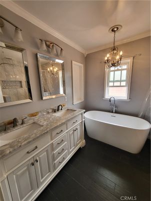 Bathroom, Chandelier, Dual Sink Vanities, Free Standing Baths, Interior, Wood Texture Flooring