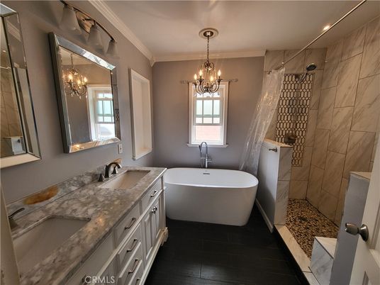 Bathroom, Chandelier, Dual Sink Vanities, Free Standing Baths, Interior, Marble Walls