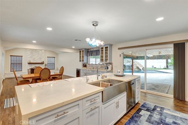 Dining room, Interior, Kitchen, Pendant Lights, Recessed Lighting, Stainless Steel Appliances, Wood Texture Flooring