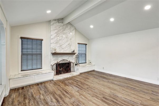 Empty room, Fireplace, Interior, Marble Walls, Recessed Lighting, Wood Texture Flooring