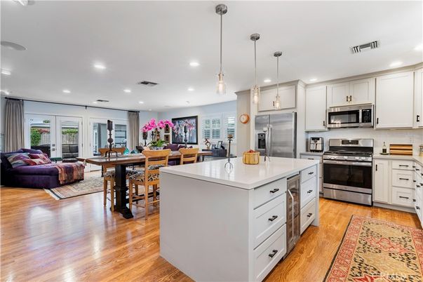 Dining room, Interior, Kitchen, Living room, Pendant Lights, Recessed Lighting, Stainless Steel Appliances, Wood Texture Flooring