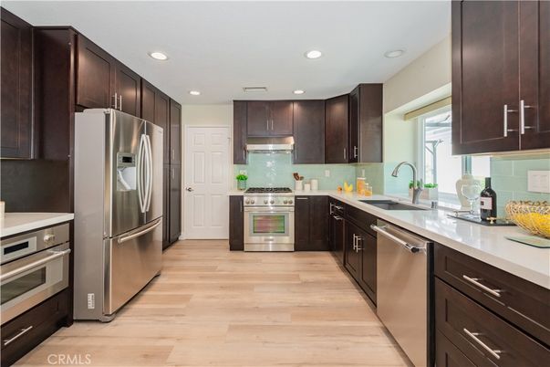 Interior, Kitchen, Recessed Lighting, Stainless Steel Appliances, Wood Texture Flooring