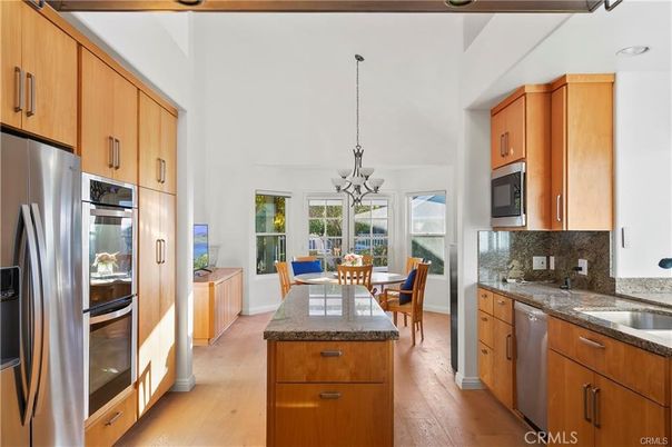 Chandelier, Dining room, Interior, Kitchen, Pendant Lights, Stainless Steel Appliances, Wood Texture Flooring