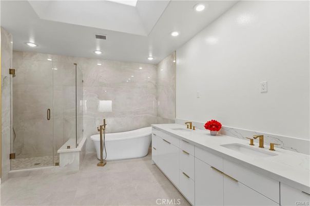 Bathroom, Dual Sink Vanities, Free Standing Baths, Glass Shower, Interior, Marble Walls, Recessed Lighting