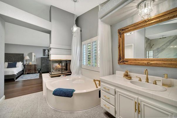Bathroom, Bedroom, Dual Sink Vanities, Fireplace, Interior, Pendant Lights, Tile Countertops, Wood Texture Flooring