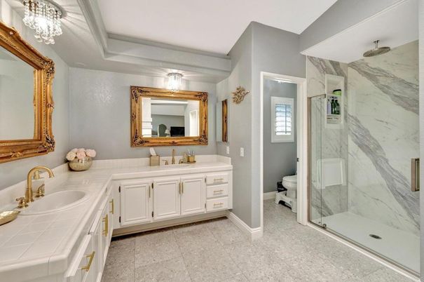 Bathroom, Dual Sink Vanities, Glass Shower, Interior, Marble Walls, Tile Countertops