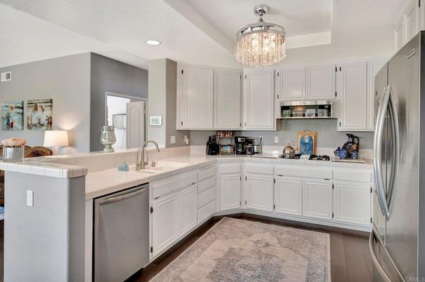 Chandelier, Interior, Kitchen, Recessed Lighting, Stainless Steel Appliances, Tile Countertops, Wood Texture Flooring
