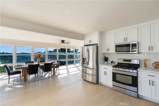 Dining room, Interior, Kitchen, Stainless Steel Appliances, Water, Wood Texture Flooring