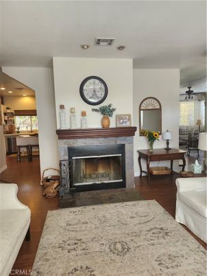 Dining room, Fireplace, Interior, Living room, Recessed Lighting, Wood Texture Flooring