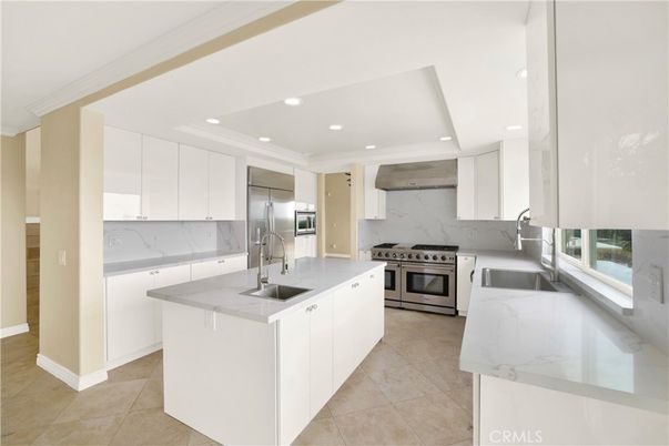 Interior, Kitchen, Marble Walls, Recessed Lighting, Stainless Steel Appliances