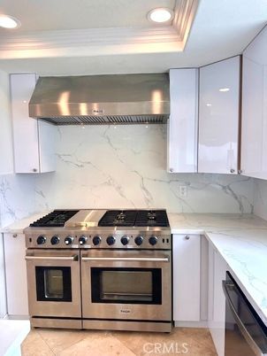 Interior, Kitchen, Marble Walls, Recessed Lighting, Stainless Steel Appliances
