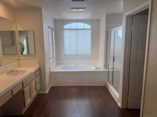 Bathroom, Dual Sink Vanities, Glass Shower, Interior, Tile Countertops, Wood Texture Flooring