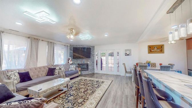 Dining room, Fireplace, Interior, Living room, Pendant Lights, Recessed Lighting, Wood Texture Flooring