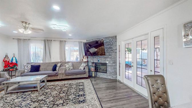 Fireplace, Interior, Living room, Recessed Lighting, Stone Walls, Wood Texture Flooring