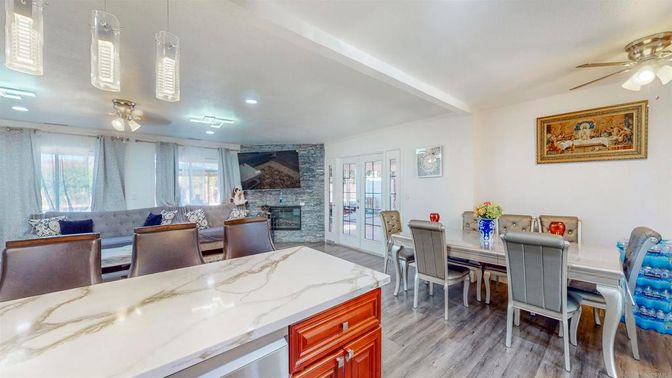 Dining room, Fireplace, Interior, Recessed Lighting, Stone Walls, Wood Texture Flooring