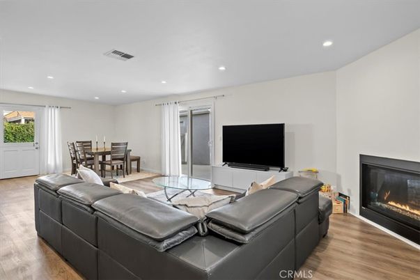 Dining room, Fireplace, Interior, Living room, Recessed Lighting, Wood Texture Flooring