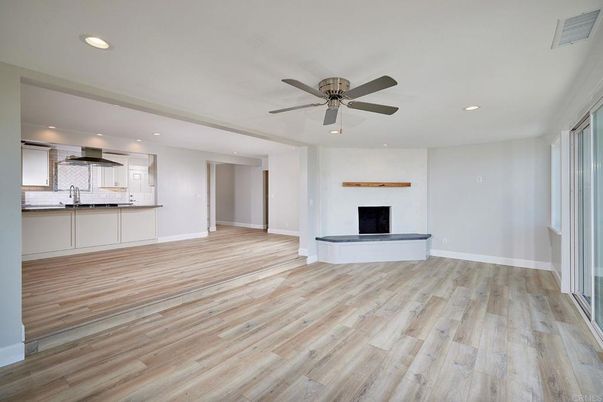 Empty room, Fireplace, Interior, Kitchen, Recessed Lighting, Wood Texture Flooring