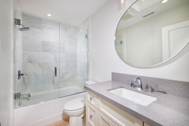 Bathroom, Glass Shower, Interior, Marble Walls, Recessed Lighting, Wood Texture Flooring