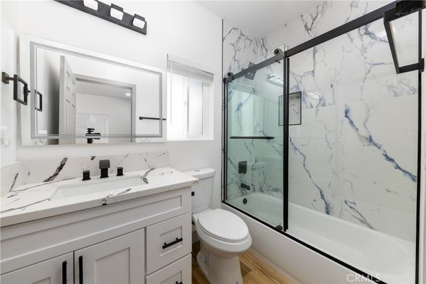 Bathroom, Glass Shower, Interior, Marble Walls, Wood Texture Flooring