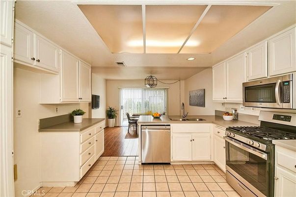 Dining room, Interior, Kitchen, Recessed Lighting, Stainless Steel Appliances, Wood Texture Flooring