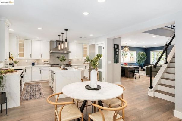 Chandelier, Dining room, Interior, Kitchen, Pendant Lights, Recessed Lighting, Stainless Steel Appliances, Wood Texture Flooring