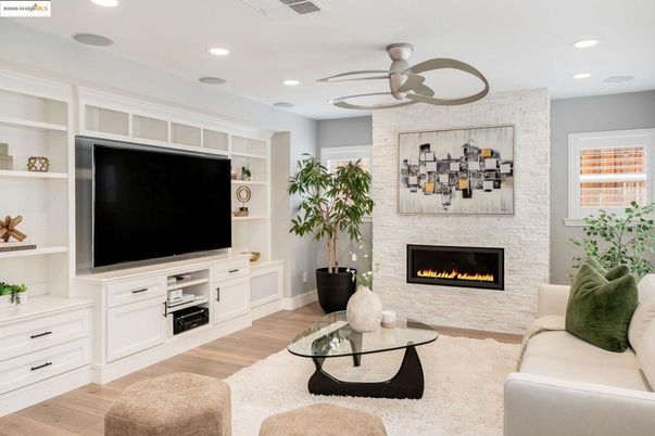 Fireplace, Interior, Living room, Recessed Lighting, Stone Walls, Wood Texture Flooring
