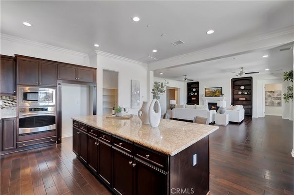 Fireplace, Interior, Kitchen, Living room, Recessed Lighting, Stainless Steel Appliances, Wood Texture Flooring