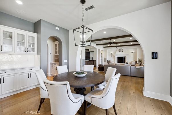 Dining room, Fireplace, Interior, Living room, Pendant Lights, Recessed Lighting, Wood Texture Flooring
