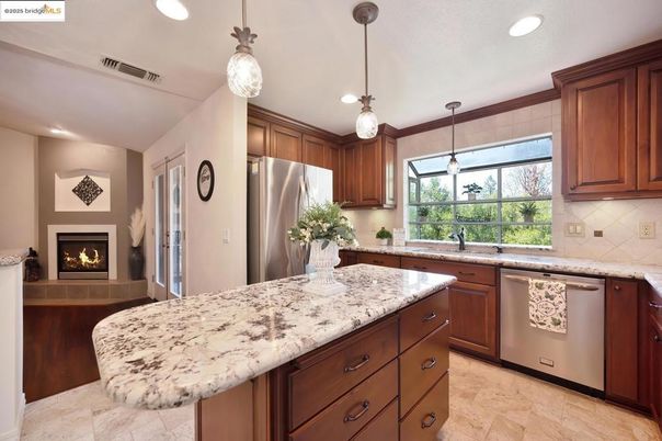Fireplace, Interior, Kitchen, Pendant Lights, Recessed Lighting, Stainless Steel Appliances