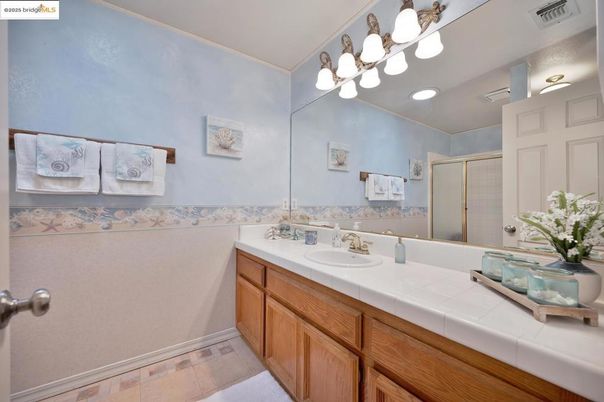 Bathroom, Dual Sink Vanities, Glass Shower, Interior, Recessed Lighting, Tile Countertops
