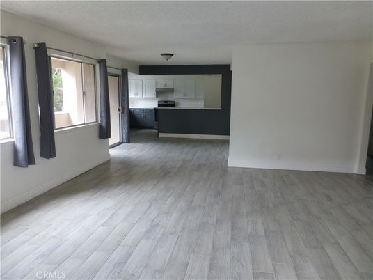 Empty room, Interior, Kitchen, Stainless Steel Appliances, Wood Texture Flooring