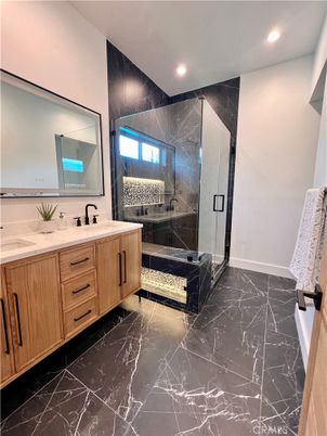 Bathroom, Dual Sink Vanities, Glass Shower, Interior, Marble, Marble Walls, Recessed Lighting