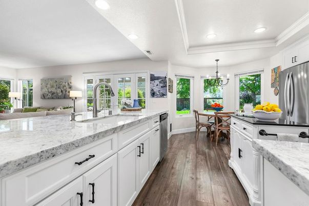 Chandelier, Dining room, Interior, Kitchen, Recessed Lighting, Stainless Steel Appliances, Wood Texture Flooring