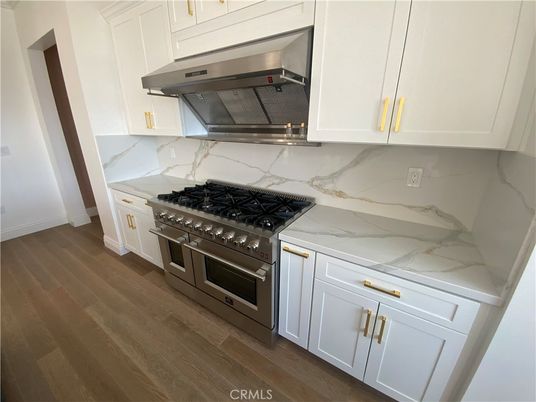 Interior, Kitchen, Marble Walls, Stainless Steel Appliances, Wood Texture Flooring