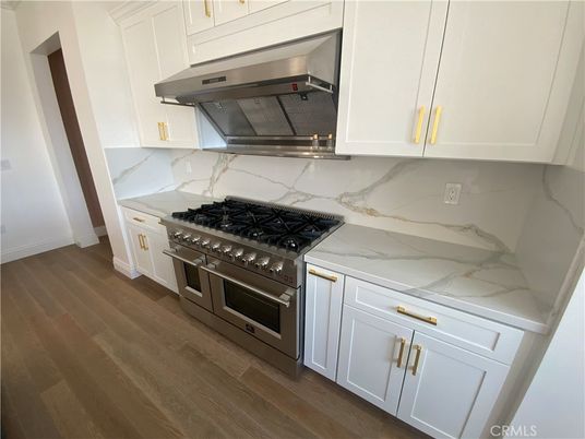 Interior, Kitchen, Marble Walls, Stainless Steel Appliances, Wood Texture Flooring