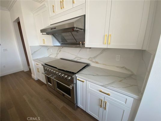 Interior, Kitchen, Marble Walls, Stainless Steel Appliances, Wood Texture Flooring