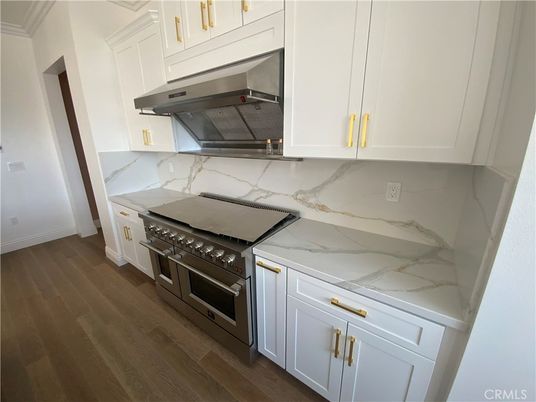 Interior, Kitchen, Marble Walls, Stainless Steel Appliances, Wood Texture Flooring