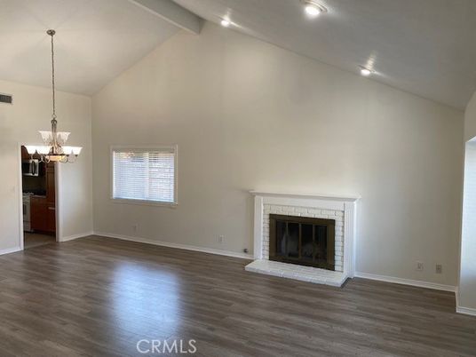 Chandelier, Empty room, Fireplace, Interior, Recessed Lighting, Wood Texture Flooring