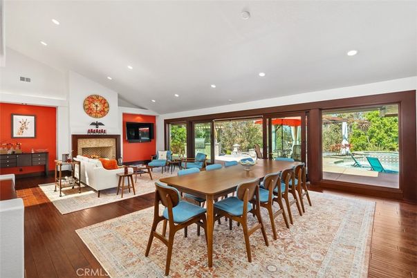 Dining room, Fireplace, Interior, Living room, Recessed Lighting, Wood Texture Flooring