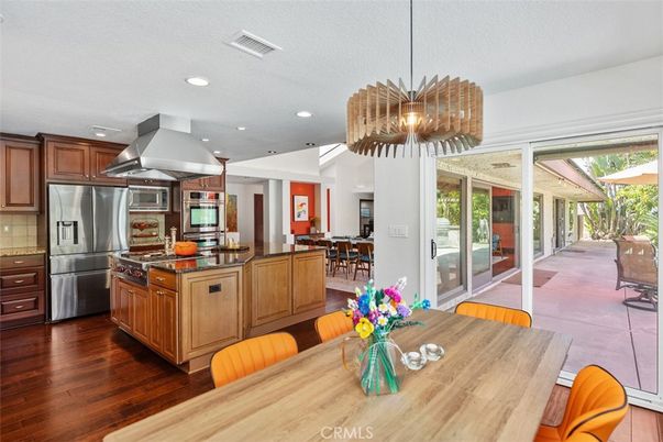 Chandelier, Dining room, Interior, Kitchen, Pendant Lights, Recessed Lighting, Stainless Steel Appliances, Wood Texture Flooring
