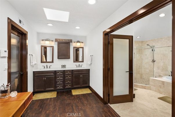 Bathroom, Dual Sink Vanities, Glass Shower, Interior, Recessed Lighting, Wood Texture Flooring