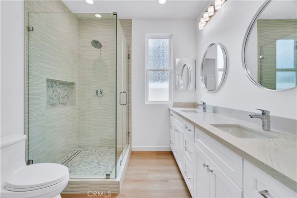 Bathroom, Dual Sink Vanities, Glass Shower, Interior, Recessed Lighting, Wood Texture Flooring