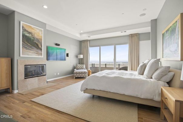 Bedroom, Fireplace, Interior, Recessed Lighting, Water, Wood Texture Flooring