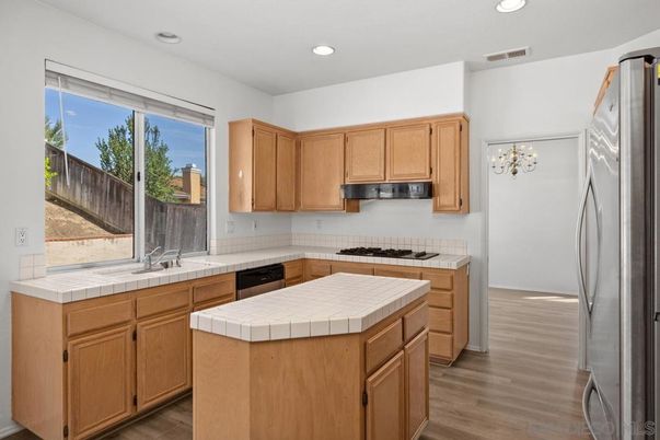 Interior, Kitchen, Recessed Lighting, Tile Countertops, Wood Texture Flooring